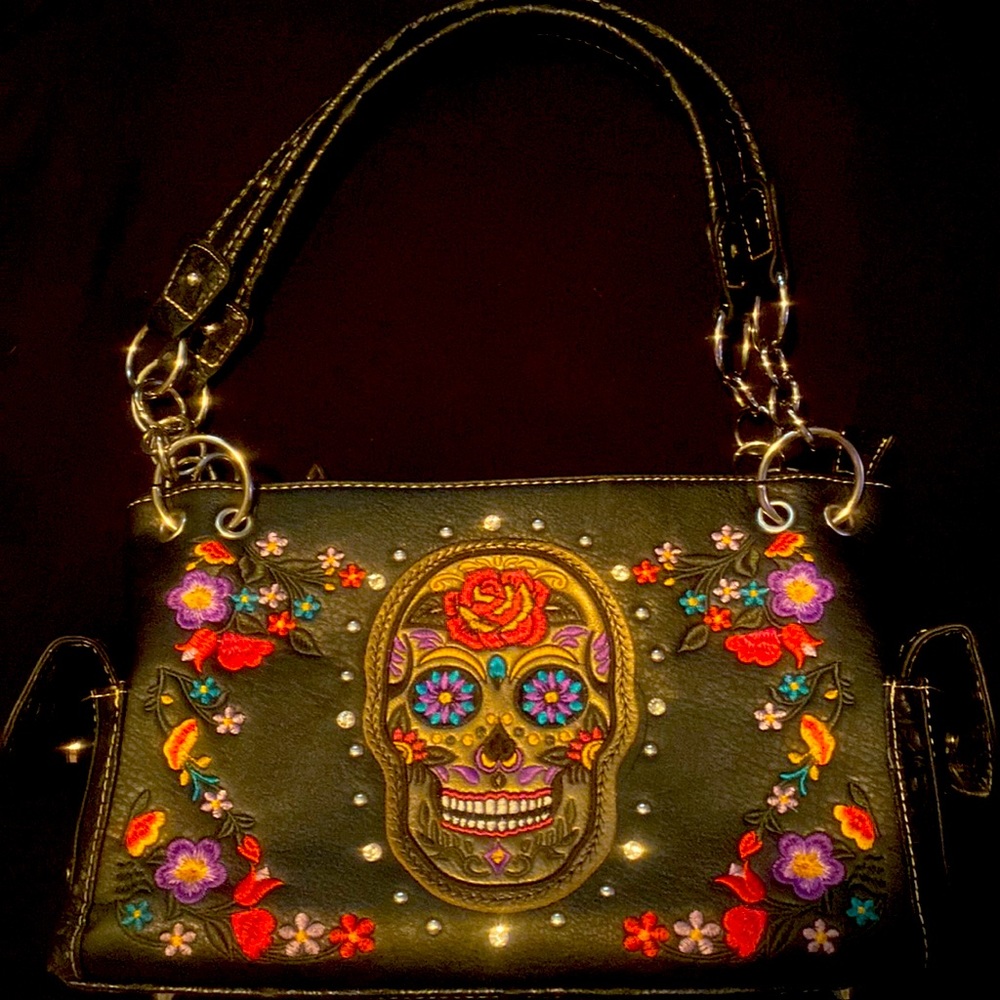 Black leather sugar skull purse with gun stash for convenient concealed carry.